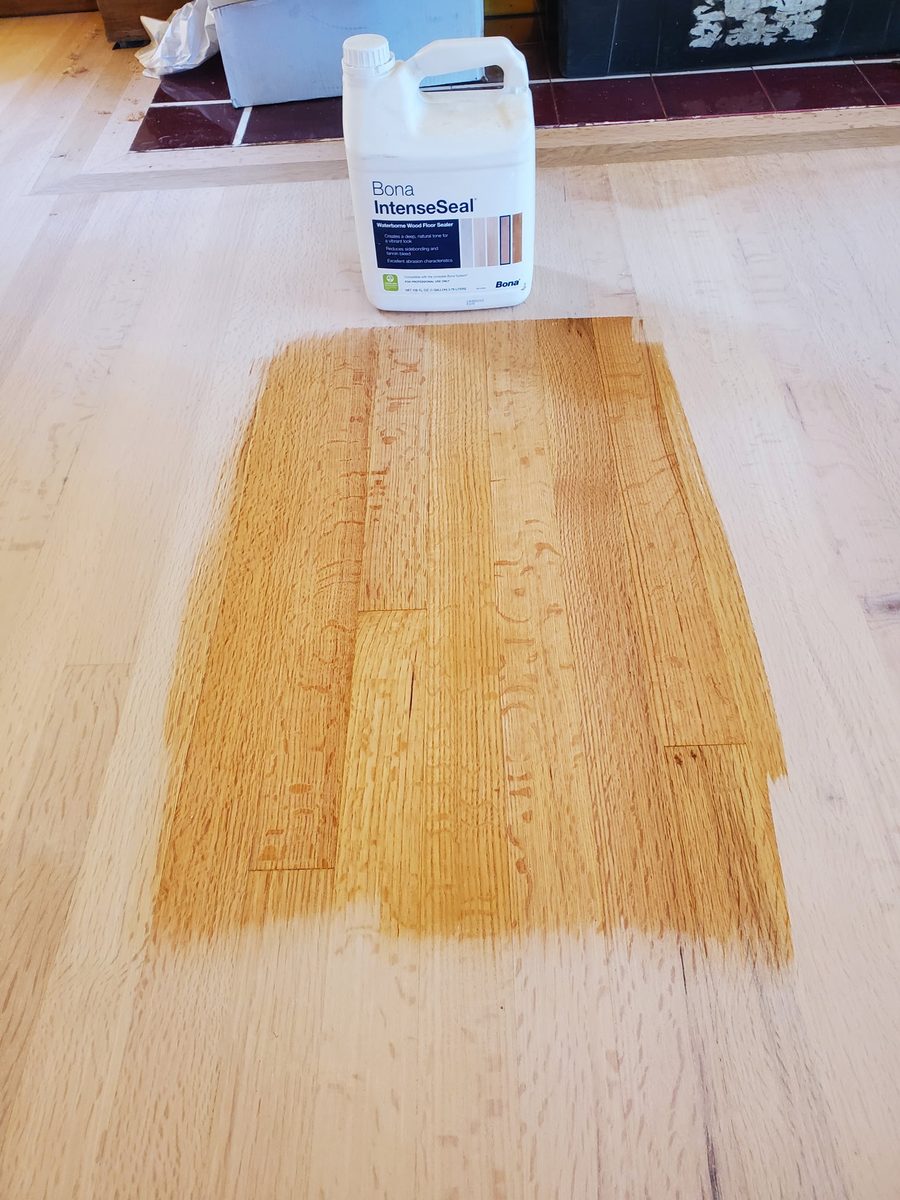 Bona waterborne sealer being applied to a white oak floor